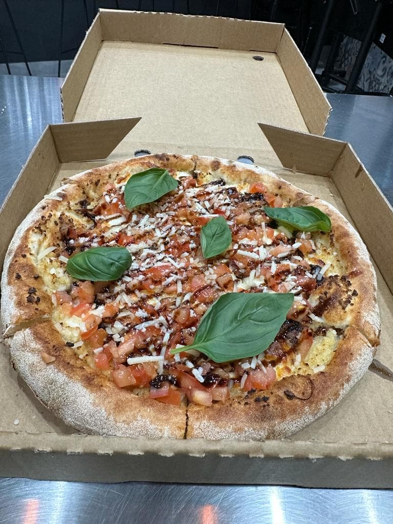 Bruschetta pizza with tomato, basil and balsamic glaze